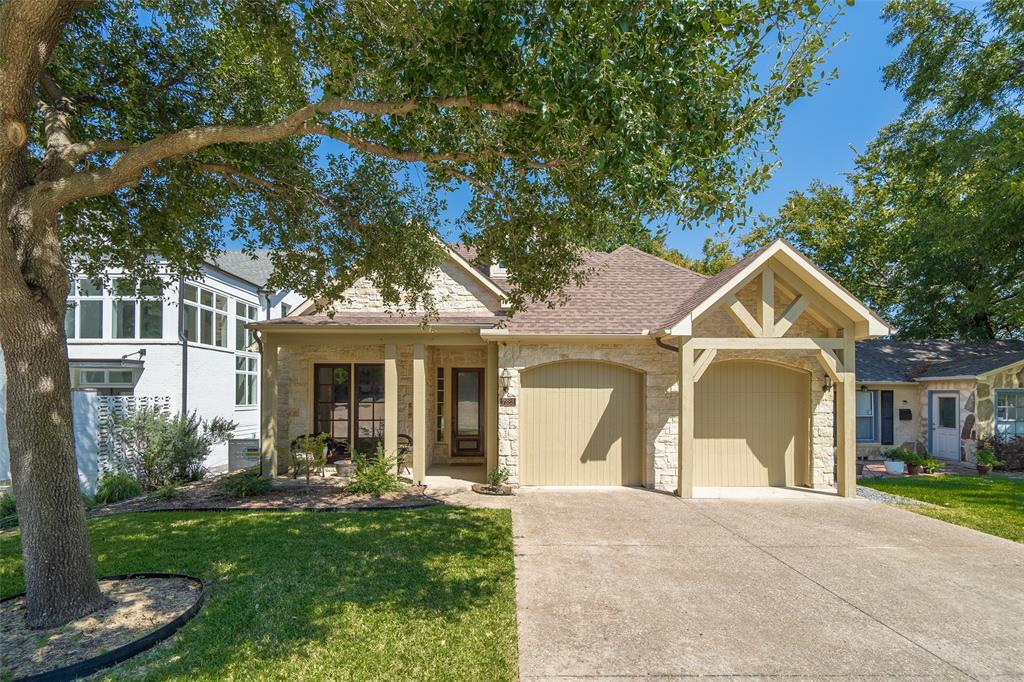 7323 Coronado Avenue Dallas, TX 75214 - Photo 1 of 1 View of front of house with a garage and a front yard