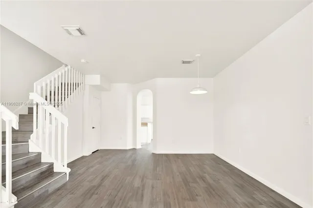 a view of entryway with wooden floor