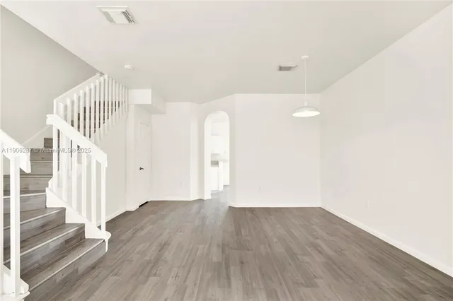 a view of entryway with wooden floor