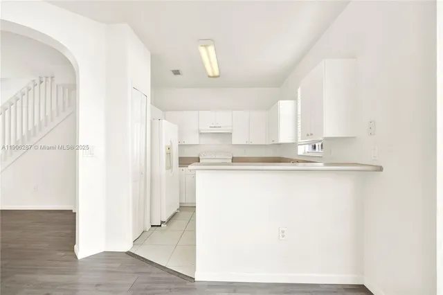 a view of kitchen with wooden floor