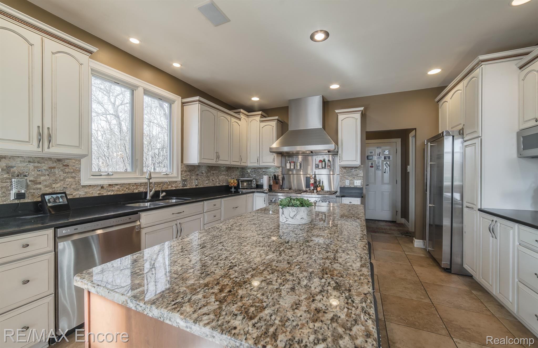 7686 Devins Ridge Clarkston, MI 48348 - Photo 13 of 58 Tons of custom cabinetry, countertop space, recessed lights, undermount lighting and more!