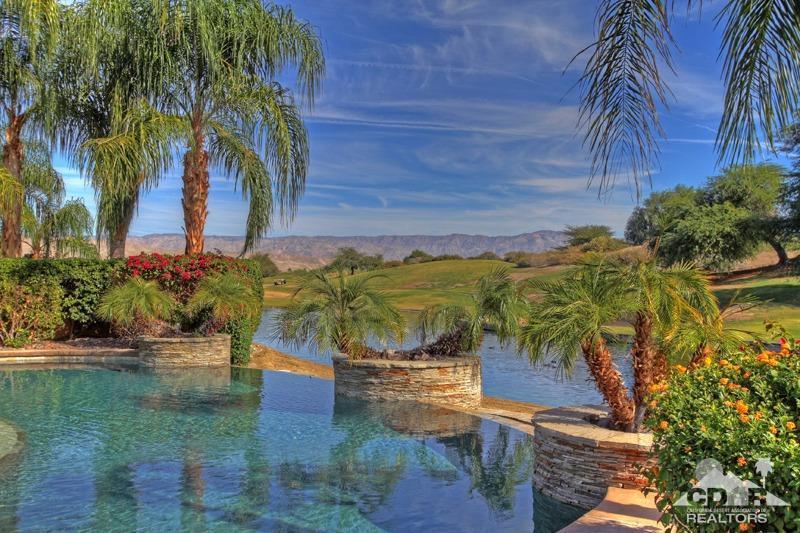 346 Loch Lomond Road Rancho Mirage, CA 92270 - Photo 1 of 34 a front view of a house with a yard