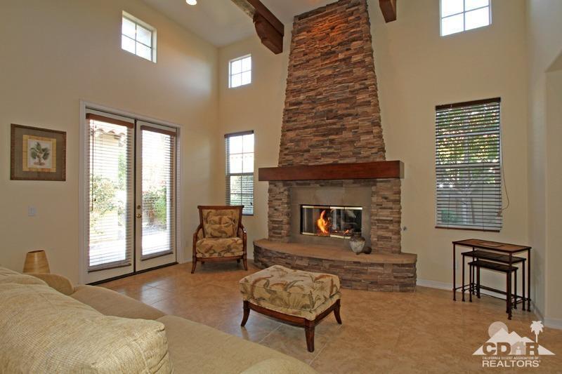 346 Loch Lomond Road Rancho Mirage, CA 92270 - Photo 16 of 34 a living room with furniture and a fireplace