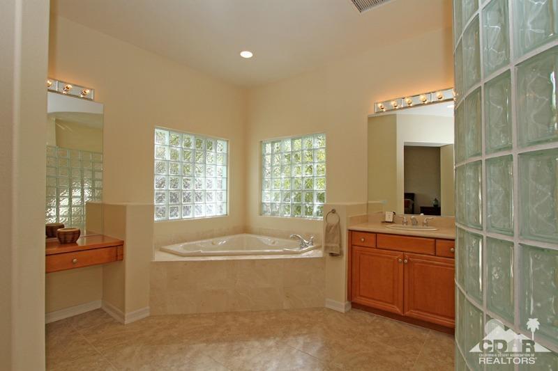 346 Loch Lomond Road Rancho Mirage, CA 92270 - Photo 19 of 34 a bathroom with a bathtub sink and mirror