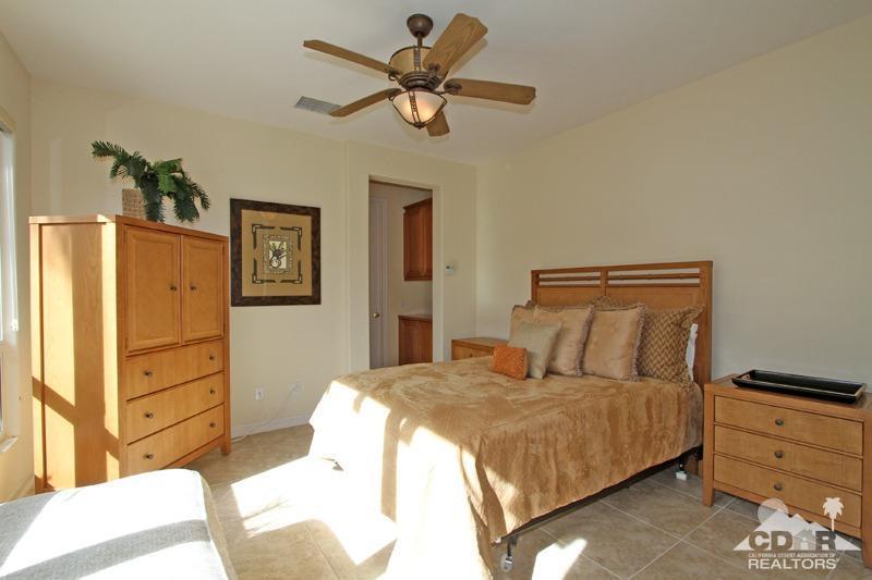 346 Loch Lomond Road Rancho Mirage, CA 92270 - Photo 21 of 34 a bedroom with a bed and cabinets