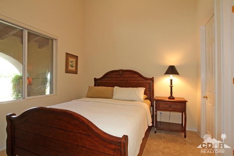 346 Loch Lomond Road Rancho Mirage, CA 92270 - Photo 23 of 34 a bedroom with a bed and a lamp