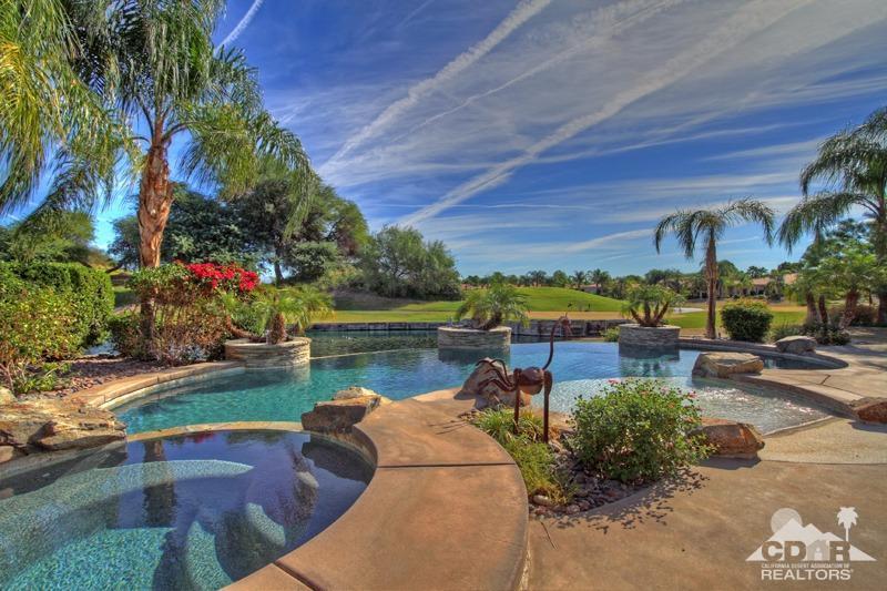 346 Loch Lomond Road Rancho Mirage, CA 92270 - Photo 31 of 34 a view of a lake with a building in front of it
