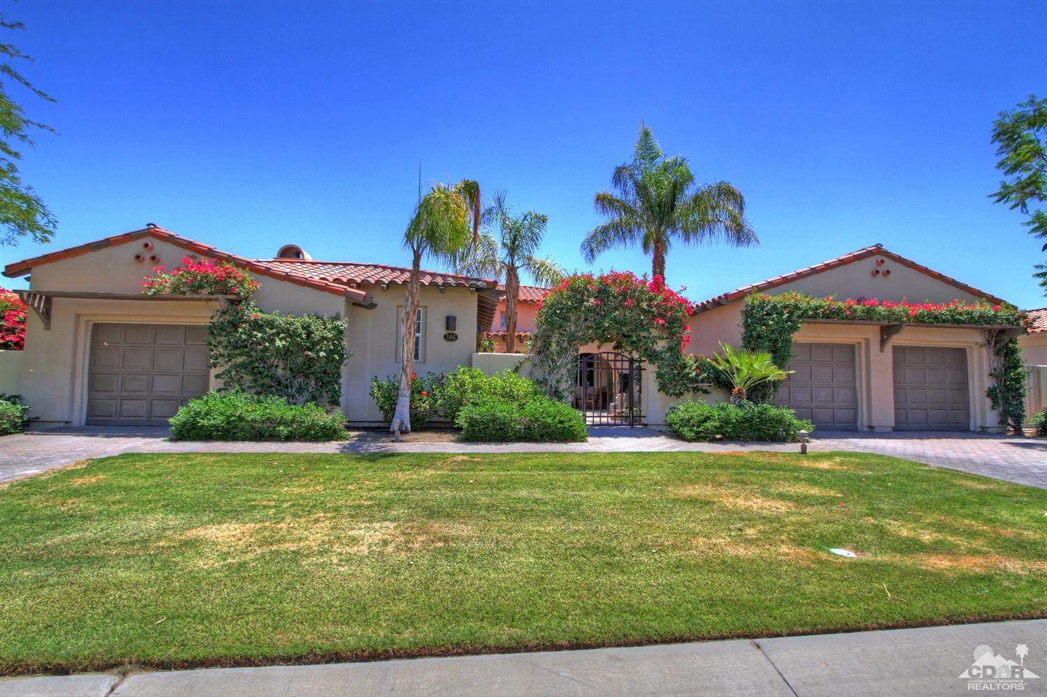 346 Loch Lomond Road Rancho Mirage, CA 92270 - Photo 4 of 34 a front view of a house with a yard and garage