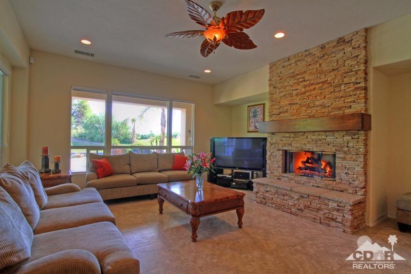 346 Loch Lomond Road Rancho Mirage, CA 92270 - Photo 7 of 34 a living room with furniture a fireplace and a flat screen tv