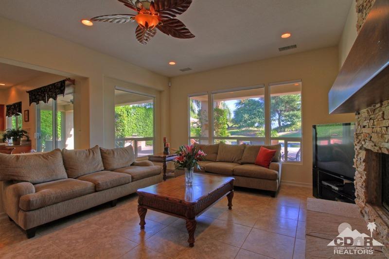 346 Loch Lomond Road Rancho Mirage, CA 92270 - Photo 8 of 34 a living room with fireplace furniture and a large window
