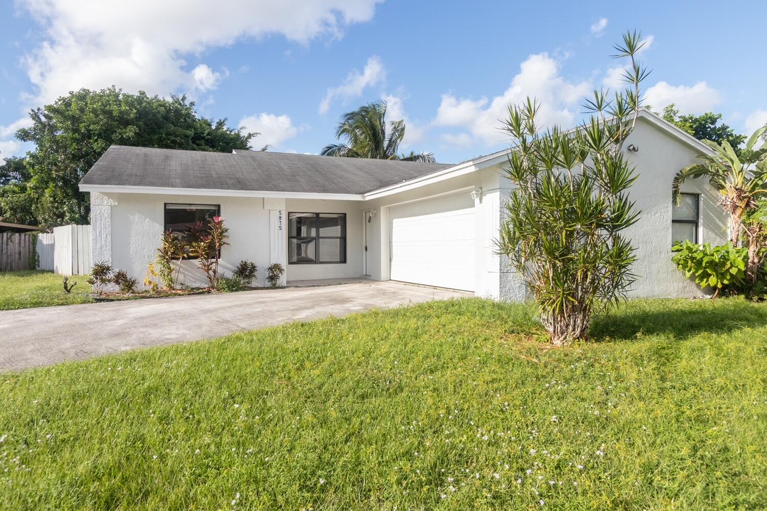 5875 Triphammer Road Lake Worth, FL 33463 - Photo 1 of 15 Front