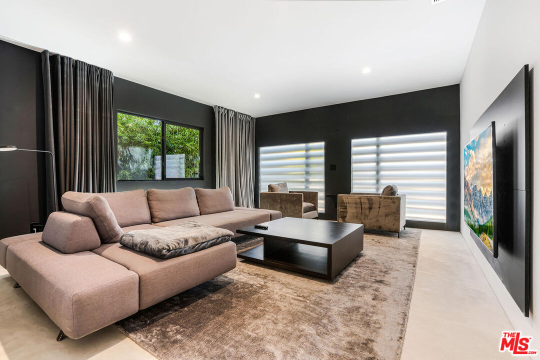 Undisclosed Address Los Angeles, CA 90064 - Photo 2 of 25 a living room with furniture fireplace and large windows
