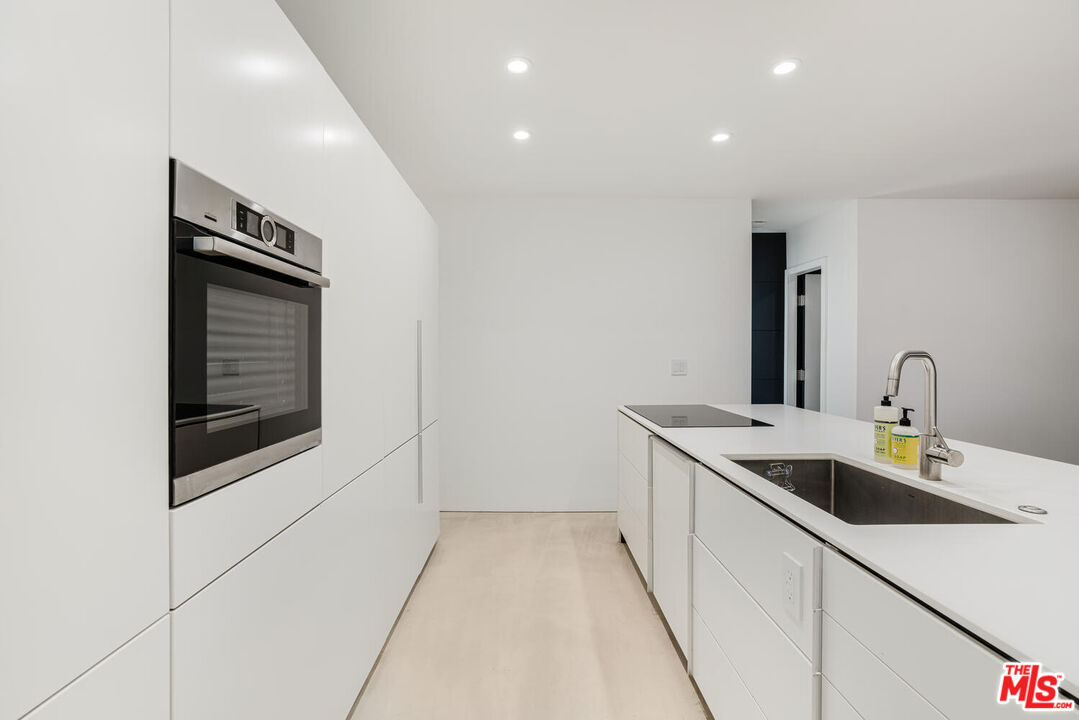 Undisclosed Address Los Angeles, CA 90064 - Photo 4 of 25 a bathroom with a sink and a mirror