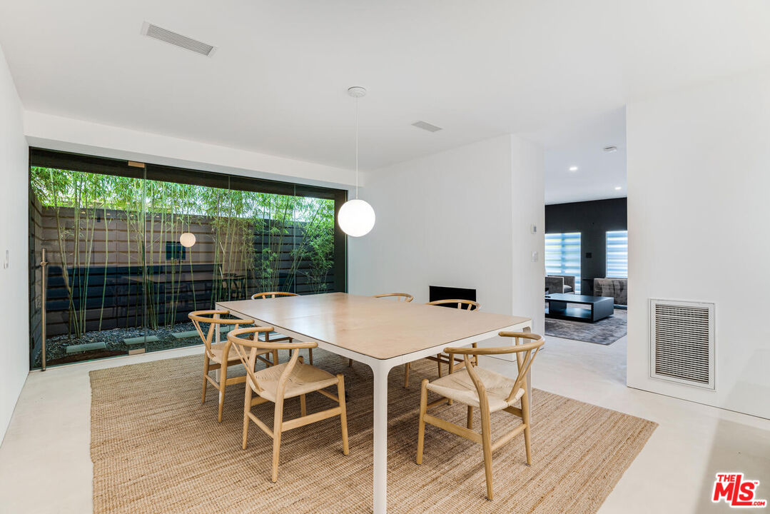 Undisclosed Address Los Angeles, CA 90064 - Photo 6 of 25 a dining room with furniture and wooden floor