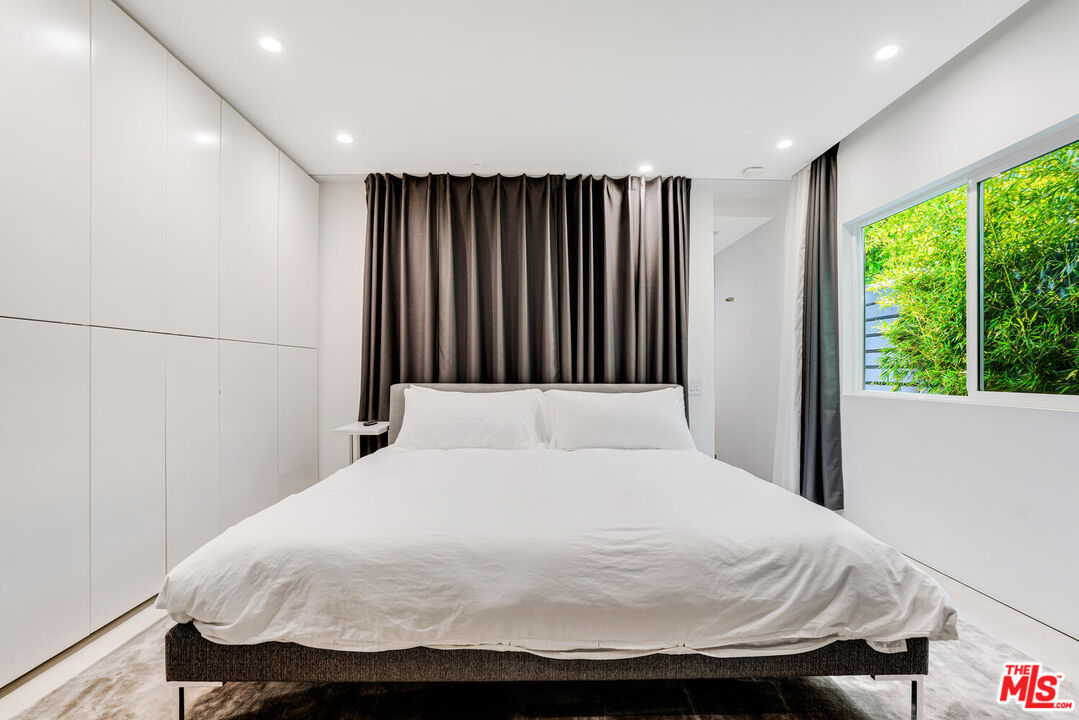 Undisclosed Address Los Angeles, CA 90064 - Photo 8 of 25 a bedroom with a bed and a window