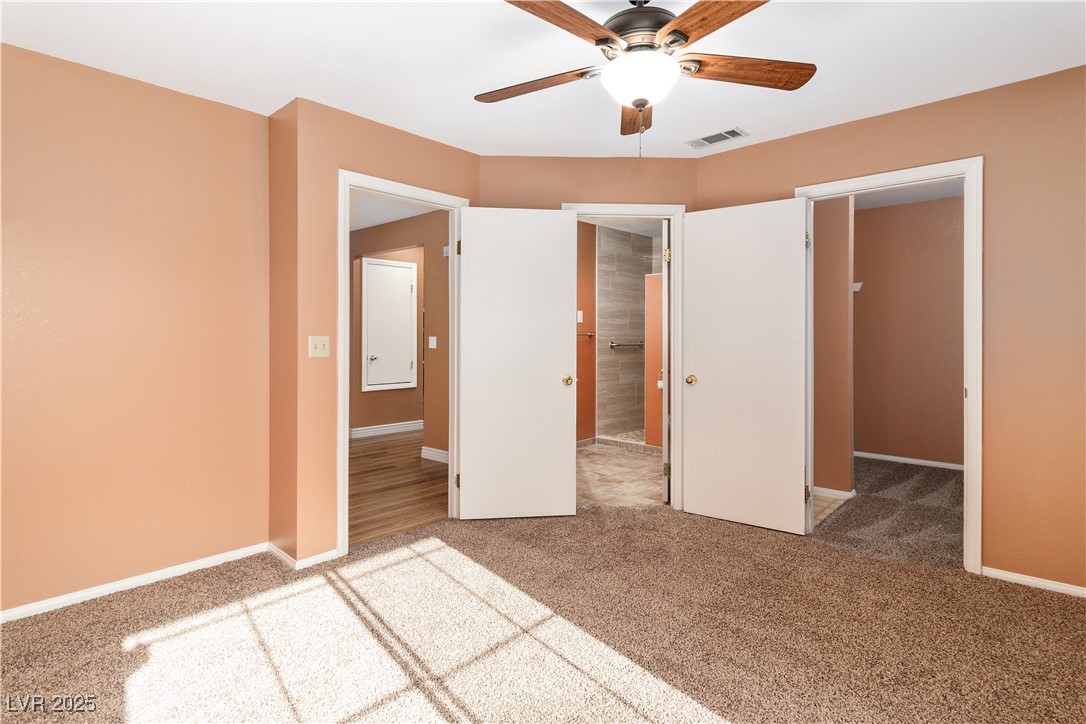 1948 Las Palmas Lane, Unit 277 Laughlin, NV 89029 - Photo 20 of 71 Unfurnished bedroom with carpet and ceiling fan