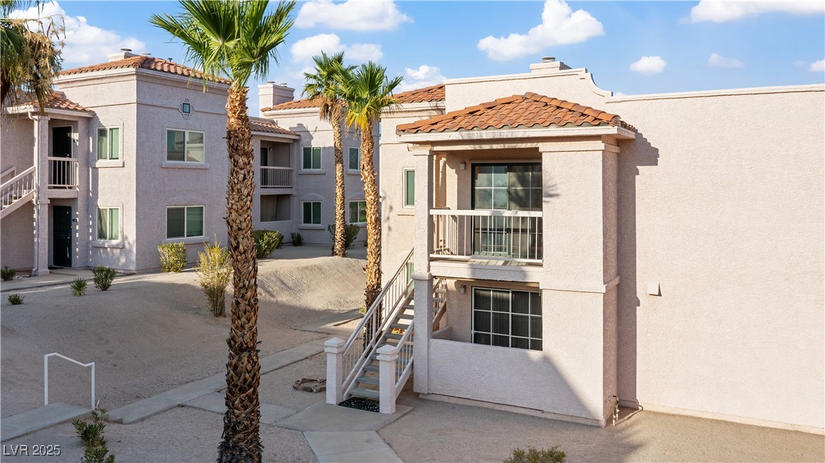 1948 Las Palmas Lane, Unit 277 Laughlin, NV 89029 - Photo 47 of 71 View of front of home with stucco siding, a tile roof, and stairway