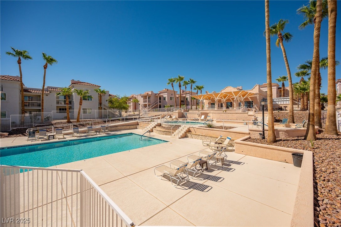 1948 Las Palmas Lane, Unit 277 Laughlin, NV 89029 - Photo 59 of 71 Community pool with a hot tub, a patio, and a residential view