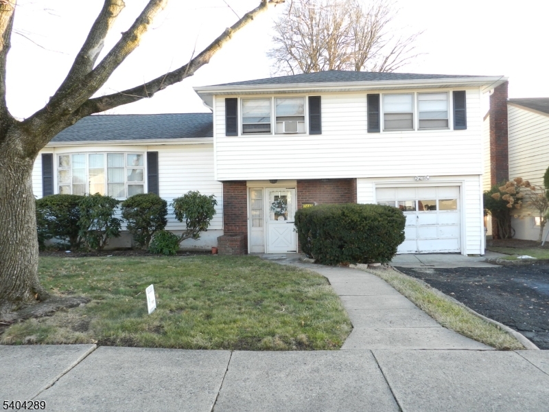 2442 Terrill Road Union, NJ 07083 - Photo 12 of 15 a front view of a house with garden and plants