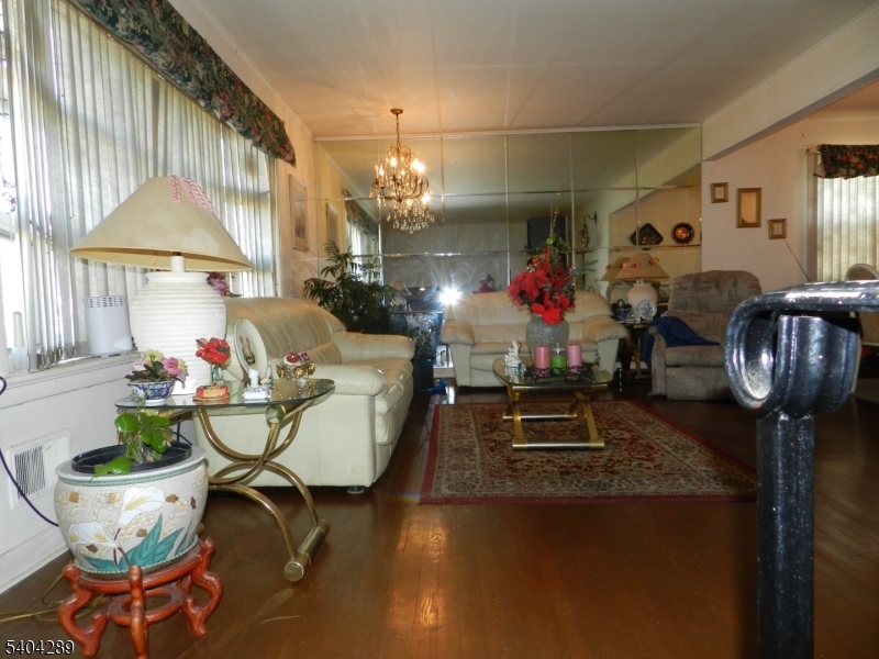 2442 Terrill Road Union, NJ 07083 - Photo 4 of 15 a living room with furniture and a chandelier