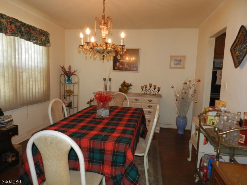 2442 Terrill Road Union, NJ 07083 - Photo 6 of 15 a bedroom with a bed and wooden floor