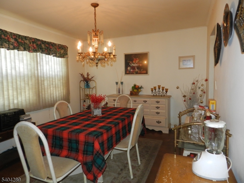 2442 Terrill Road Union, NJ 07083 - Photo 7 of 15 a view of a dining room with furniture and chandelier