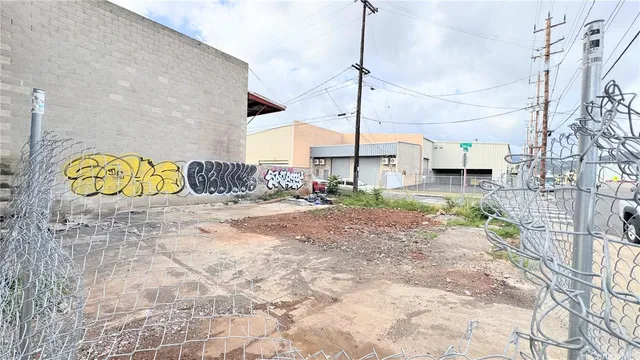 a bed room with a couch and a potted plant
