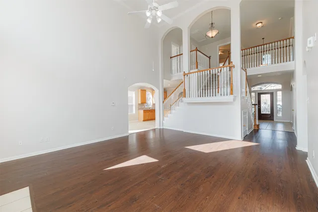 a view of a room with wooden floor