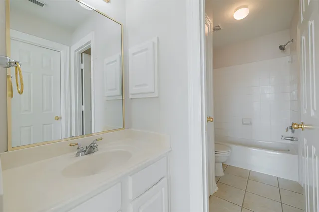a bathroom with a bathtub and a sink