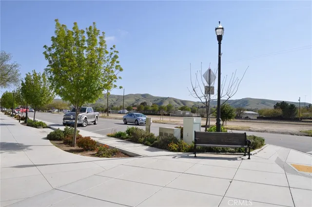 a view of a swimming pool with lawn chairs