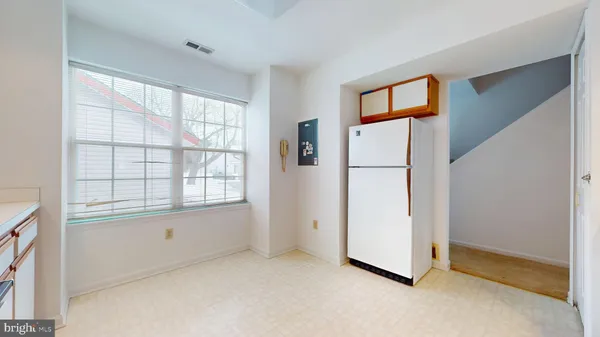 a view of a hallway with stairs