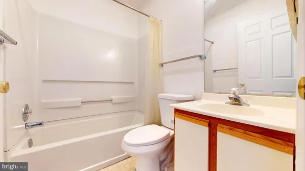 a bathroom with a sink toilet bathtub and vanity