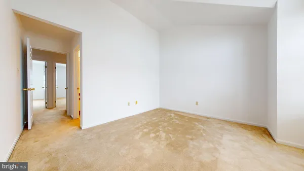 a balcony with table and chairs