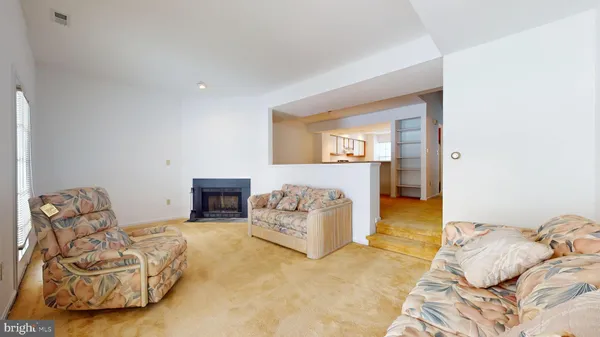 a bedroom with furniture and a fireplace