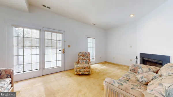 a bedroom with furniture and a fireplace