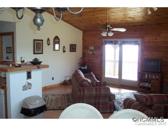 460 Barn Cove Road Clyde, NC 28721 - Photo 12 of 24 a living room with furniture and a fireplace