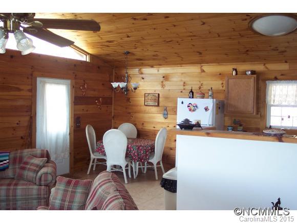 460 Barn Cove Road Clyde, NC 28721 - Photo 13 of 24 a view of a dining room with furniture