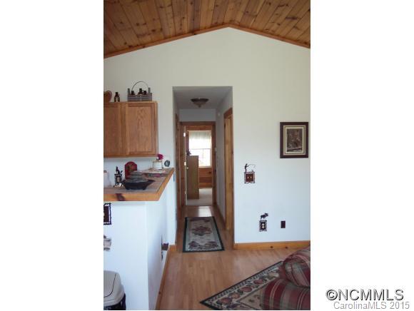 460 Barn Cove Road Clyde, NC 28721 - Photo 15 of 24 a living room with furniture and a wooden floor