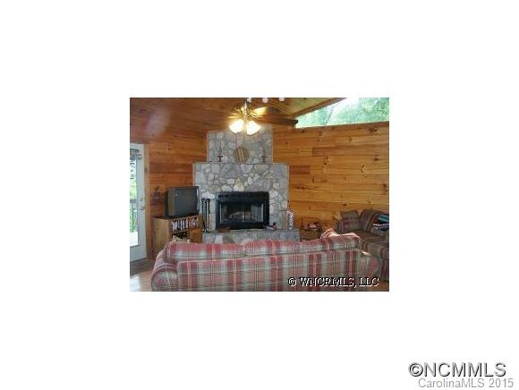 460 Barn Cove Road Clyde, NC 28721 - Photo 3 of 24 a picture of a living room with a fireplace