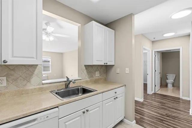 a kitchen with a sink and cabinets