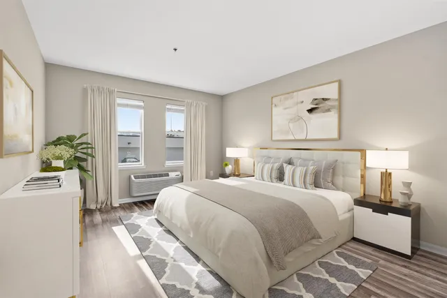 a bedroom with a bed furniture and a window