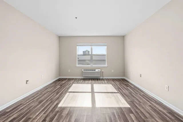 a view of a room that has a rug in it