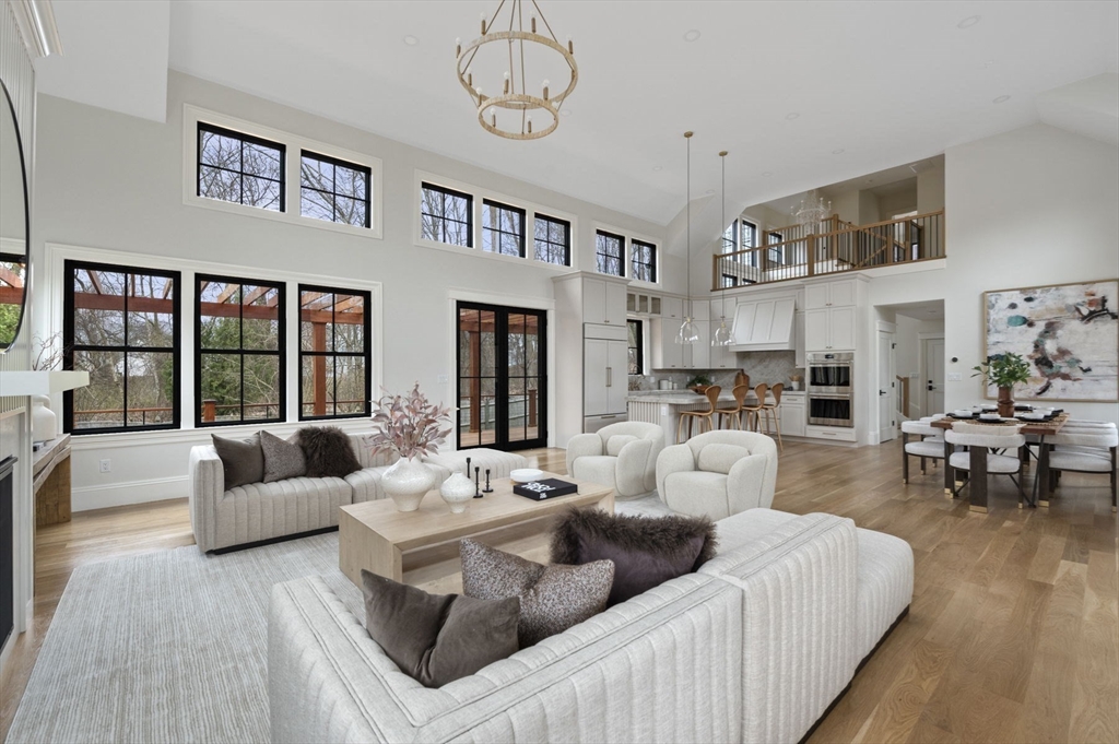 16 Liberty Road Marblehead, MA 01945 - Photo 11 of 42 a living room with furniture kitchen view and a large window