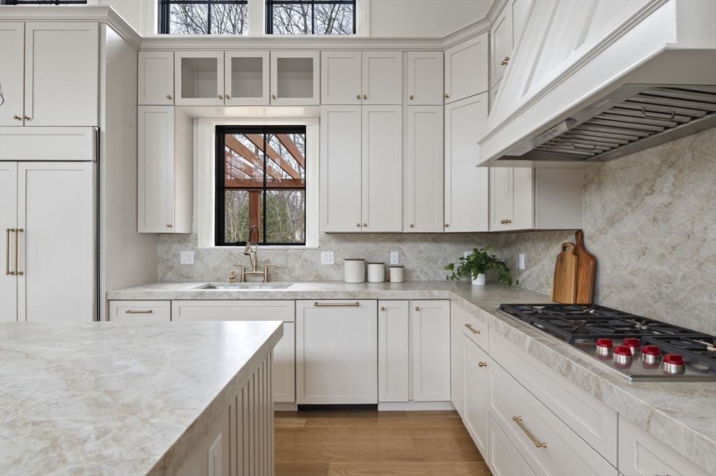 16 Liberty Road Marblehead, MA 01945 - Photo 15 of 42 a kitchen with stainless steel appliances granite countertop a sink stove and cabinets