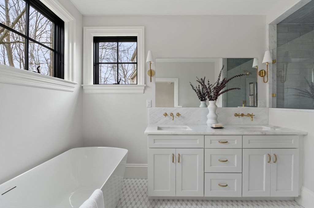 16 Liberty Road Marblehead, MA 01945 - Photo 24 of 42 a bathroom with a sink and a mirror