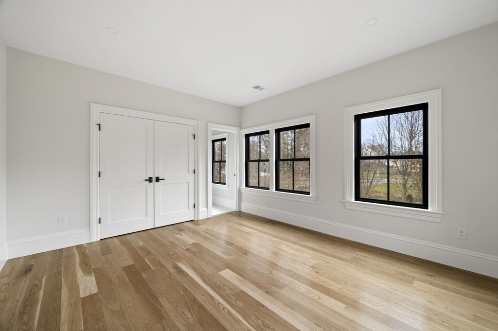 16 Liberty Road Marblehead, MA 01945 - Photo 28 of 42 a view of an empty room with wooden floor and a window