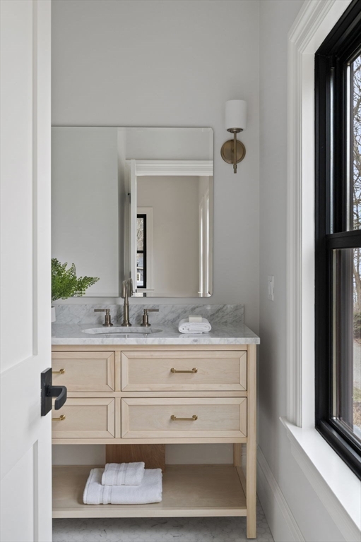 16 Liberty Road Marblehead, MA 01945 - Photo 29 of 42 a bathroom with a sink and a mirror