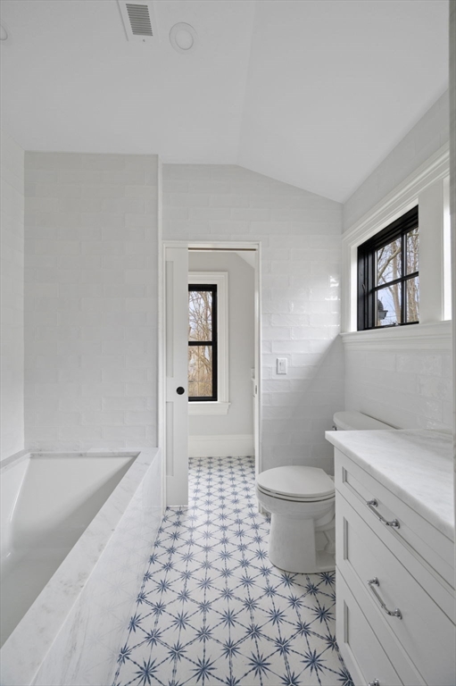 16 Liberty Road Marblehead, MA 01945 - Photo 36 of 42 a bathroom with a sink a toilet and shower