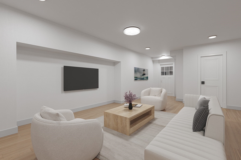 16 Liberty Road Marblehead, MA 01945 - Photo 39 of 42 a living room with furniture and a flat screen tv