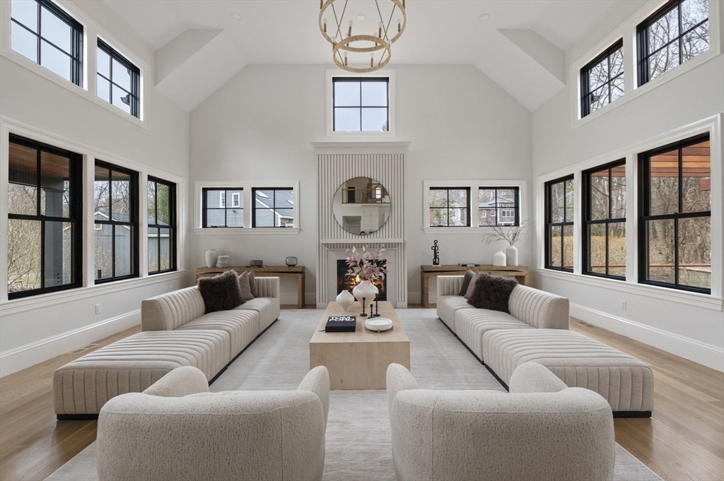 16 Liberty Road Marblehead, MA 01945 - Photo 6 of 42 a living room with fireplace furniture and a large window